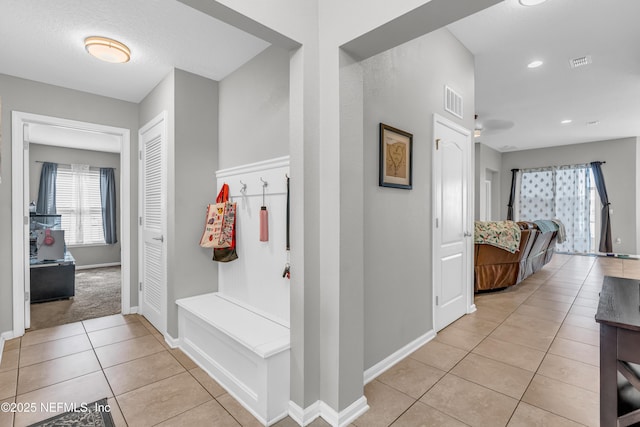 mudroom with light tile patterned floors