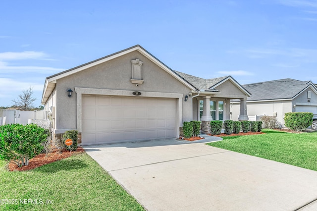 ranch-style house featuring a garage and a front lawn