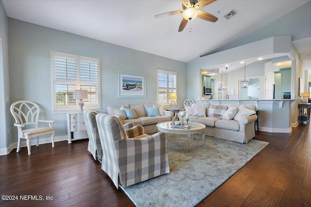 living room featuring dark wood-type flooring, ceiling fan, and lofted ceiling