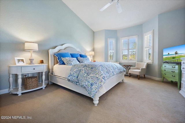 bedroom featuring vaulted ceiling, carpet floors, and ceiling fan