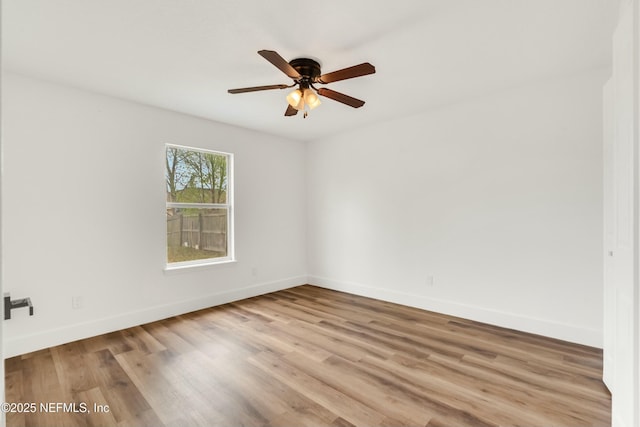 spare room with ceiling fan and light hardwood / wood-style floors