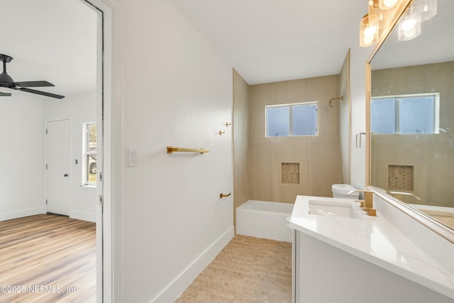 bathroom featuring ceiling fan and vanity