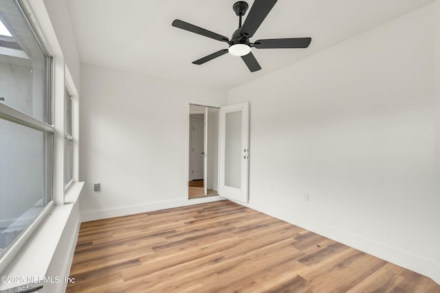 spare room with light hardwood / wood-style flooring and ceiling fan