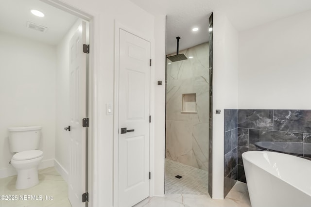 bathroom featuring tile walls, plus walk in shower, and toilet