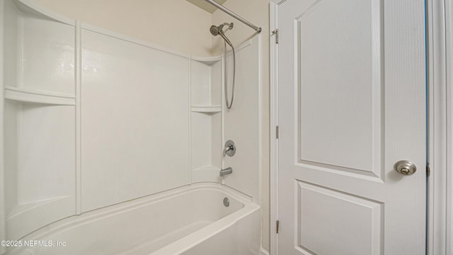 bathroom with bathing tub / shower combination