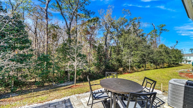 view of patio / terrace with outdoor dining area and central AC