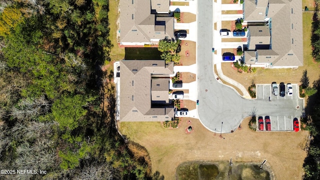 birds eye view of property with a residential view