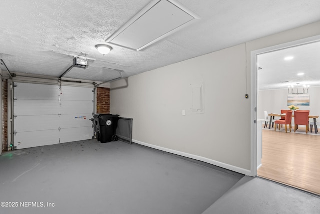 garage featuring a garage door opener and electric panel