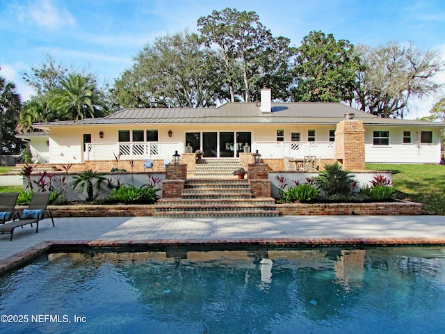 back of house with a patio area