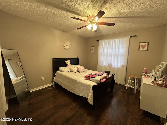 bedroom featuring ceiling fan, dark hardwood / wood-style floors, and a textured ceiling