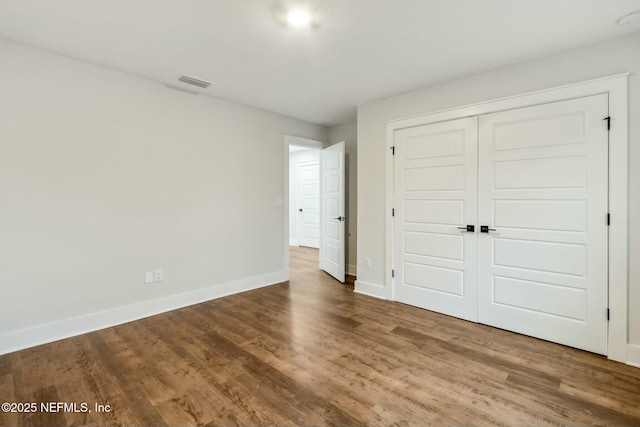 85158 Southern Creek Blvd, Fernandina Beach, FL 32034 - unfurnished bedroom featuring hardwood / wood-style floors and a closet