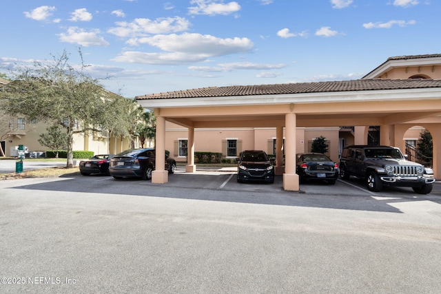 view of partially covered parking lot