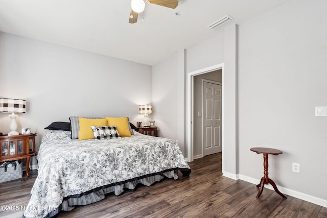 bedroom featuring a ceiling fan, visible vents, baseboards, and wood finished floors