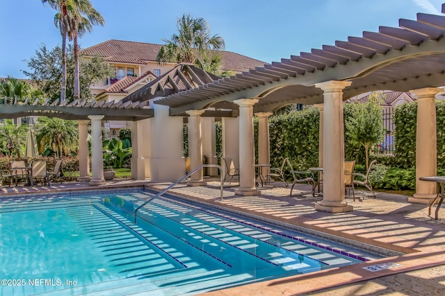 pool featuring a patio area and a pergola