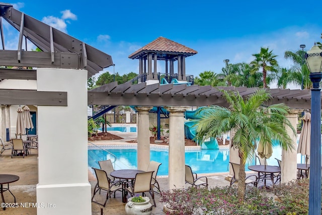 community pool featuring a patio and a pergola