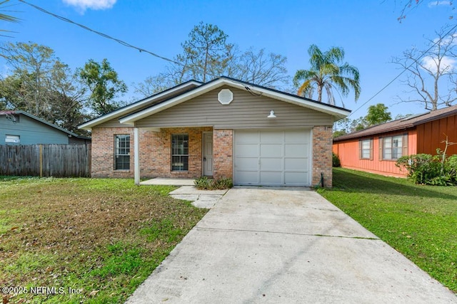 single story home featuring a garage and a front yard