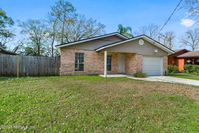 ranch-style home featuring a garage and a front yard