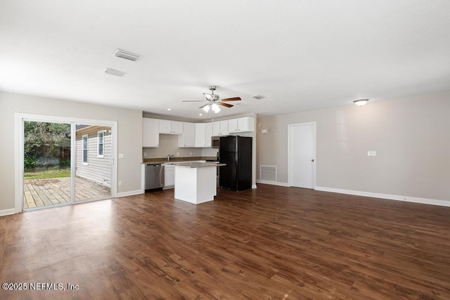 kitchen with dark hardwood / wood-style floors, a kitchen island, ceiling fan, stainless steel appliances, and white cabinets