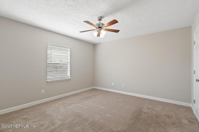 unfurnished room featuring ceiling fan, carpet floors, and a textured ceiling