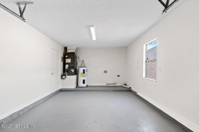 garage featuring heating unit and water heater