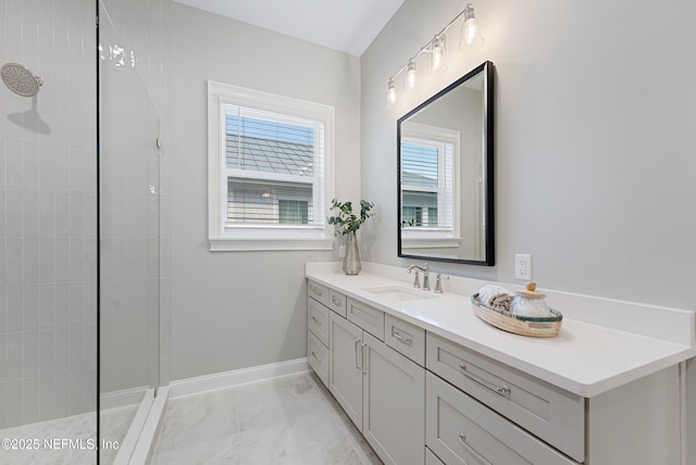 bathroom featuring vanity and a tile shower