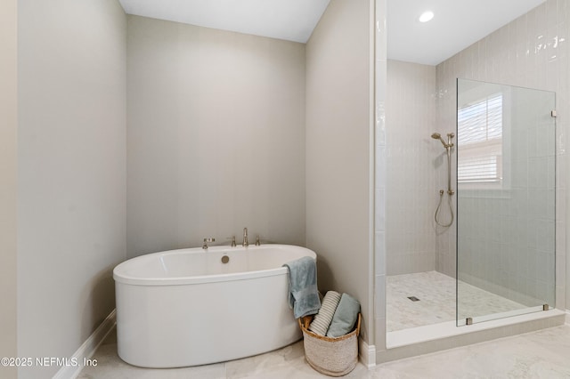 bathroom with shower with separate bathtub