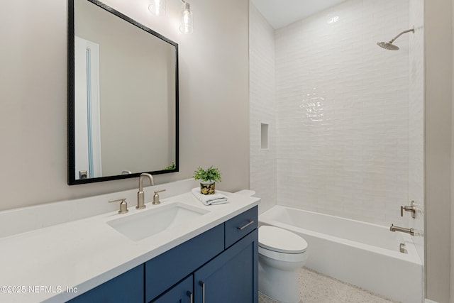 full bathroom with vanity, toilet, and tiled shower / bath combo