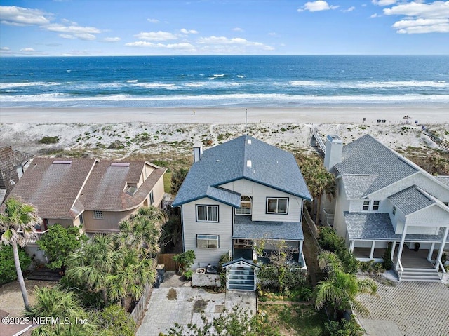 drone / aerial view with a view of the beach and a water view