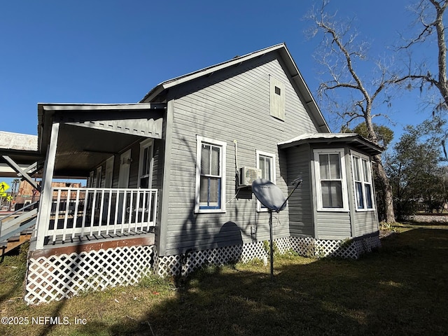 view of property exterior with a porch