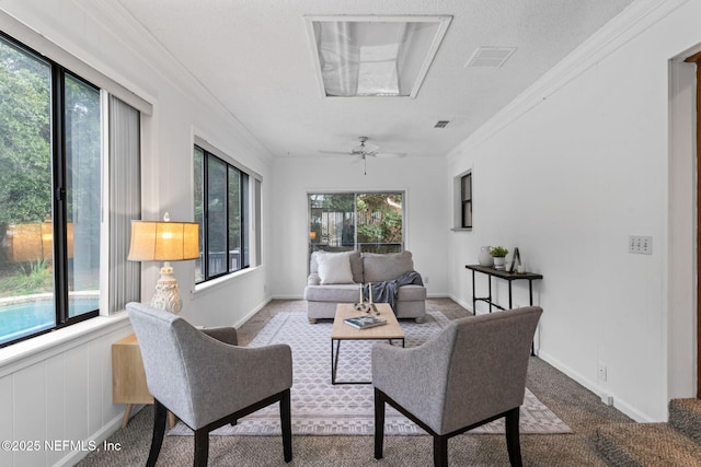 sunroom / solarium featuring ceiling fan