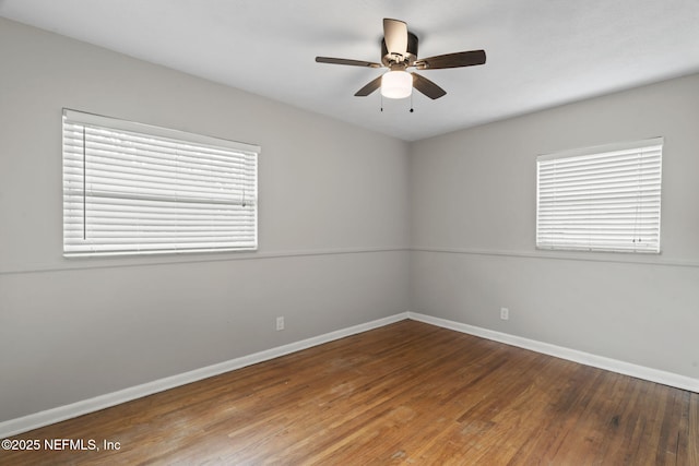 unfurnished room with hardwood / wood-style flooring and ceiling fan