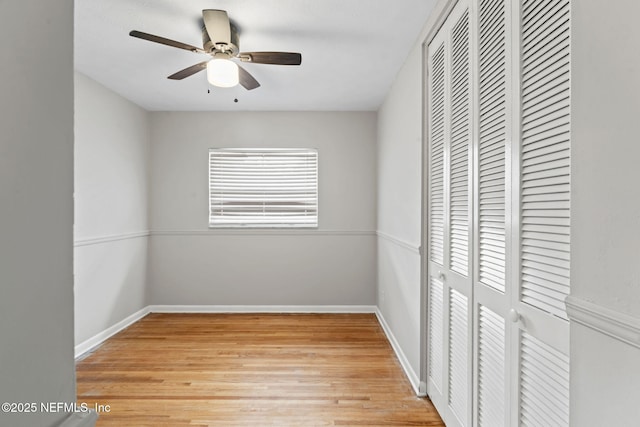 unfurnished bedroom with ceiling fan, light hardwood / wood-style floors, and a closet