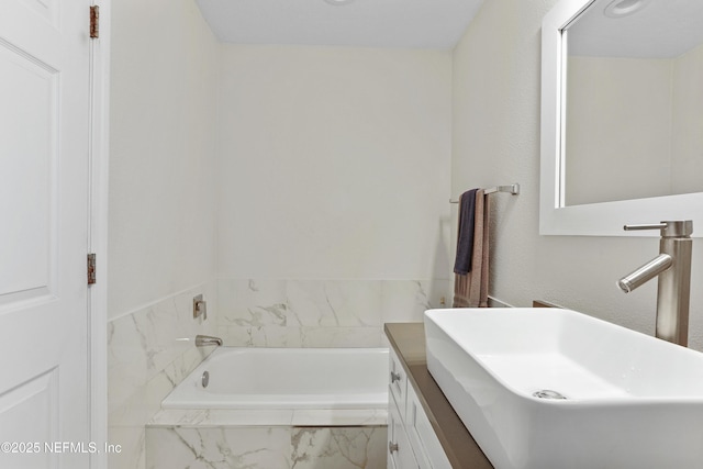 full bathroom with a garden tub and vanity