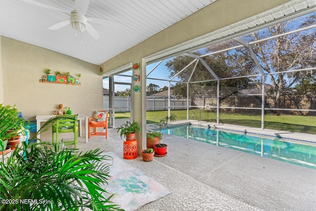 view of swimming pool with a fenced in pool, a lanai, a patio area, and fence