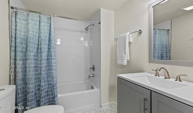 bathroom with a textured ceiling, toilet, vanity, and shower / bathtub combination with curtain