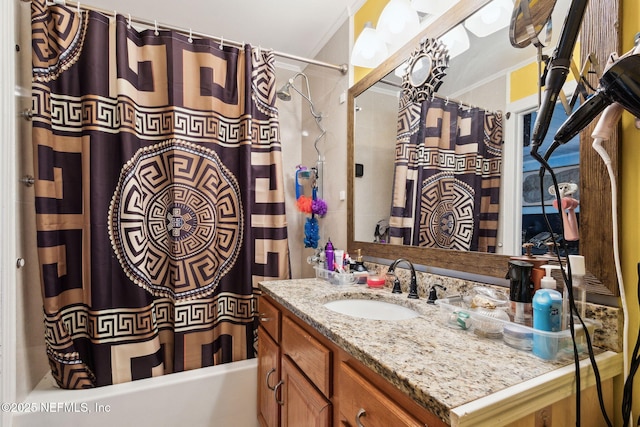 bathroom with crown molding, vanity, and shower / tub combo