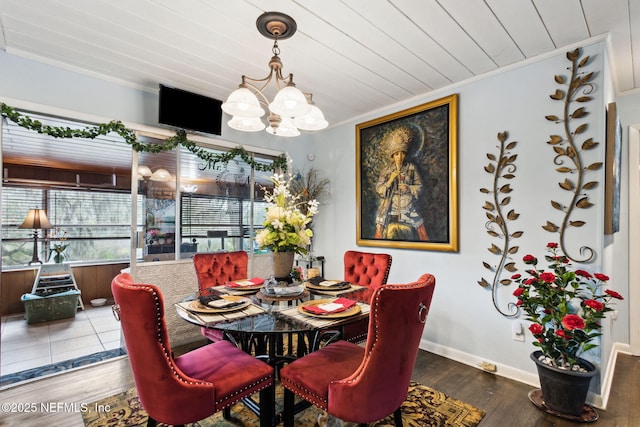 dining room with a notable chandelier, crown molding, wooden ceiling, and hardwood / wood-style flooring