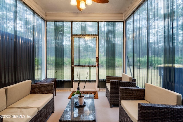 sunroom / solarium with plenty of natural light and a ceiling fan