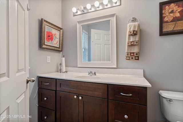 half bath with toilet and vanity