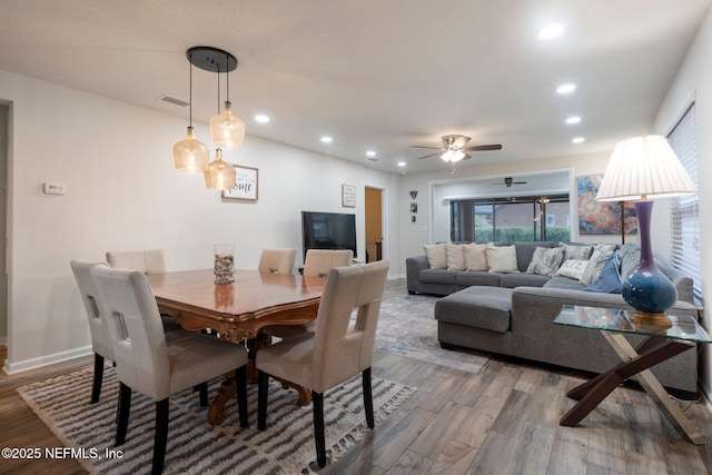 dining room featuring recessed lighting, visible vents, baseboards, and wood finished floors