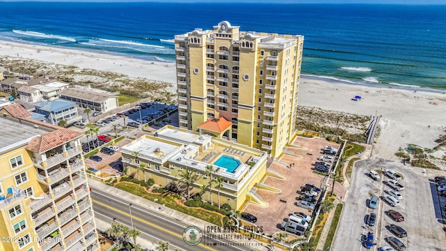 bird's eye view with a view of the beach and a water view