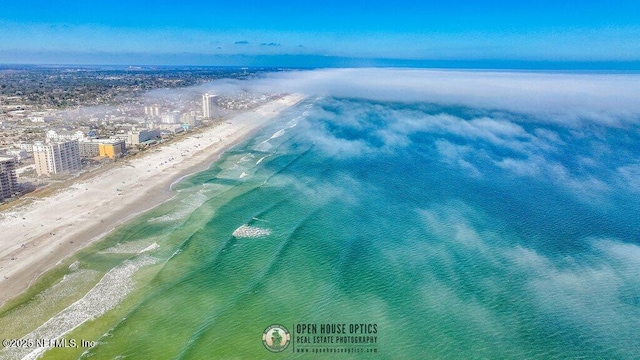 bird's eye view featuring a beach view and a water view