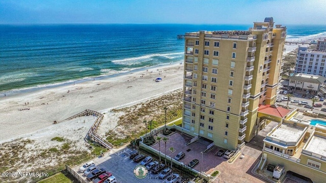 bird's eye view with a view of the beach and a water view