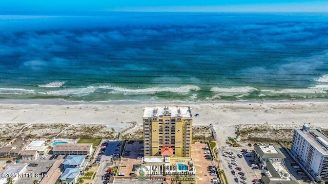 bird's eye view featuring a beach view and a water view