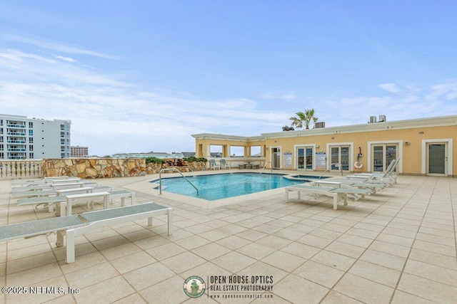 view of swimming pool with a patio area