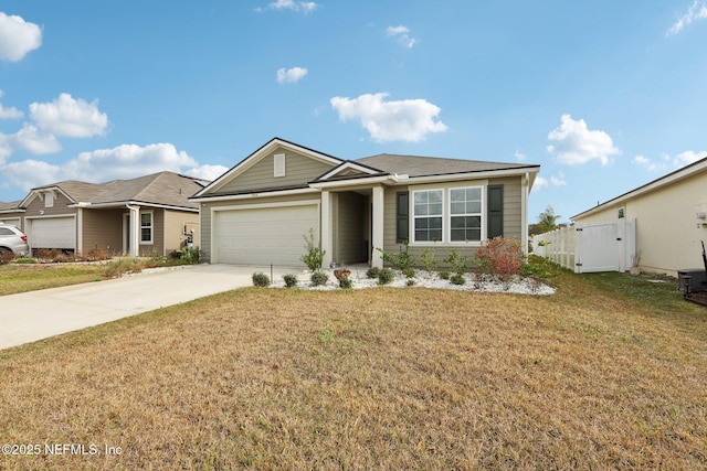 view of front of property with a garage and a front lawn