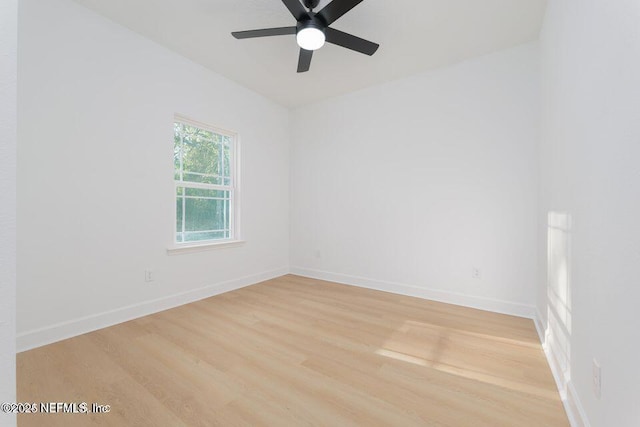 empty room with hardwood / wood-style flooring and ceiling fan