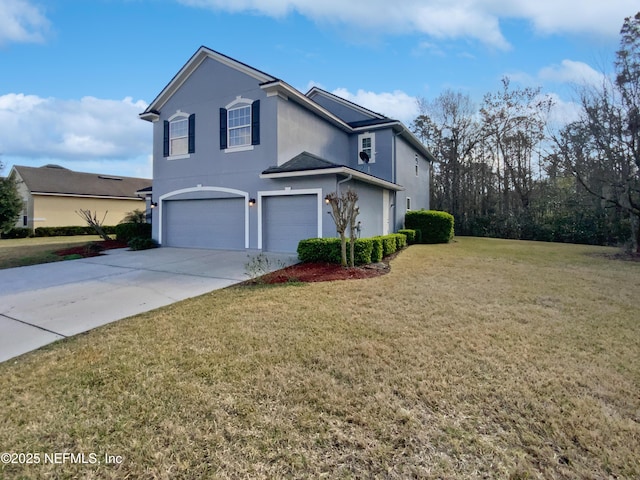 front of property featuring a front lawn and a garage