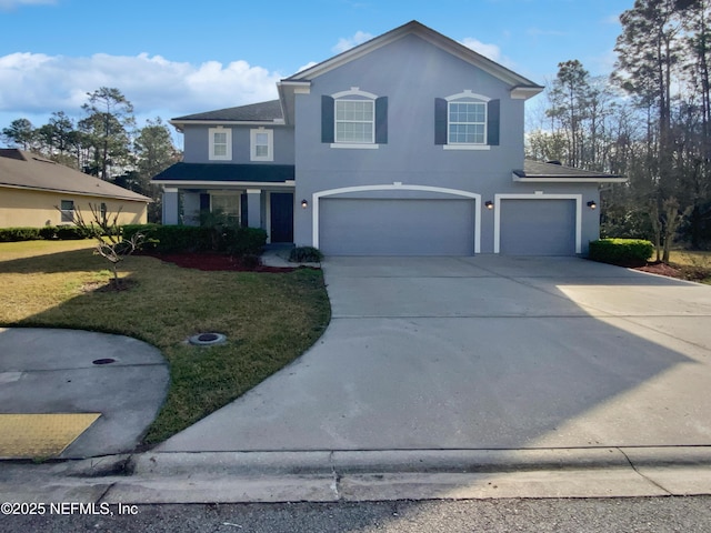 front facade with a front lawn and a garage