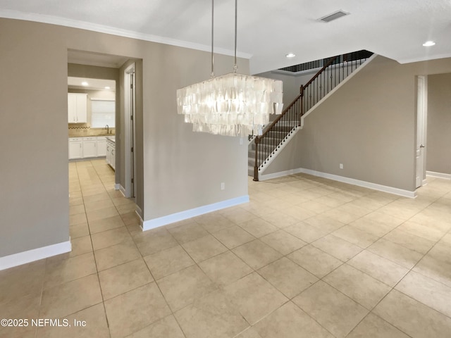 interior space featuring an inviting chandelier, light tile patterned floors, sink, and ornamental molding